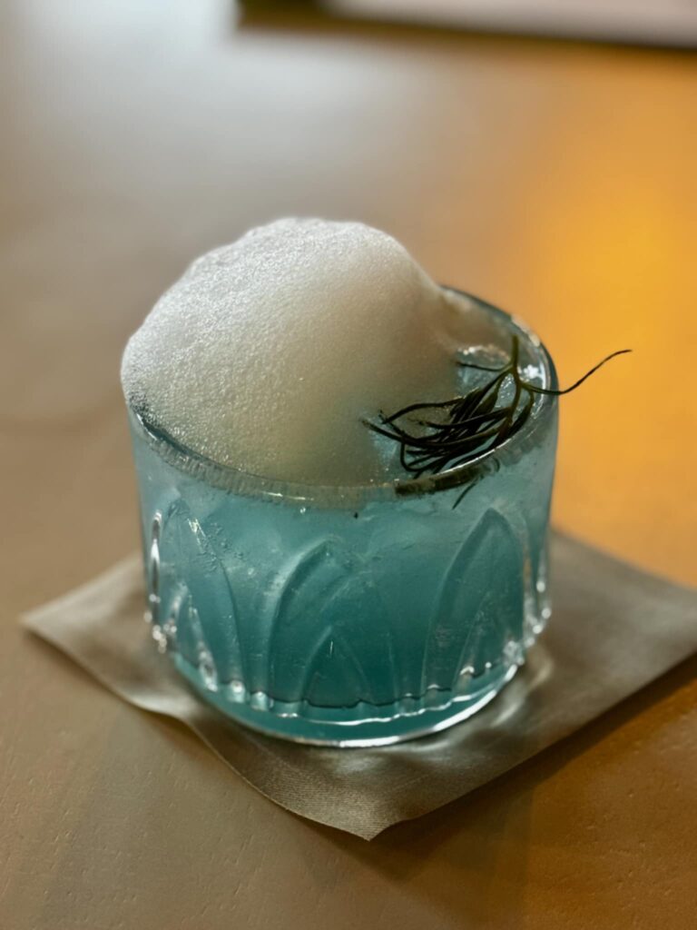 As we perused the menu, we tried a cocktail recommended by our waiter: Sea You In Santorini. (Courtesy)