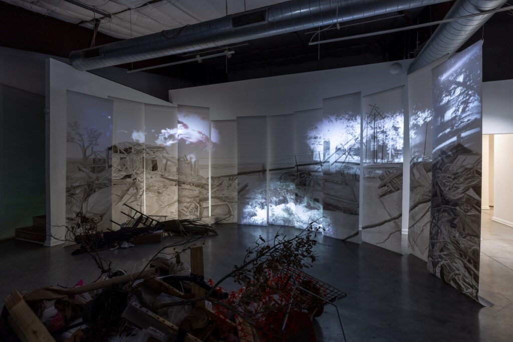 Hammonds + West’s exhibition “The River Entered My Home” at Art League Houston features large-scale drawings by Hollis Hammonds and recordings of poetry by Sasha West. (Photo by Alex Barber)