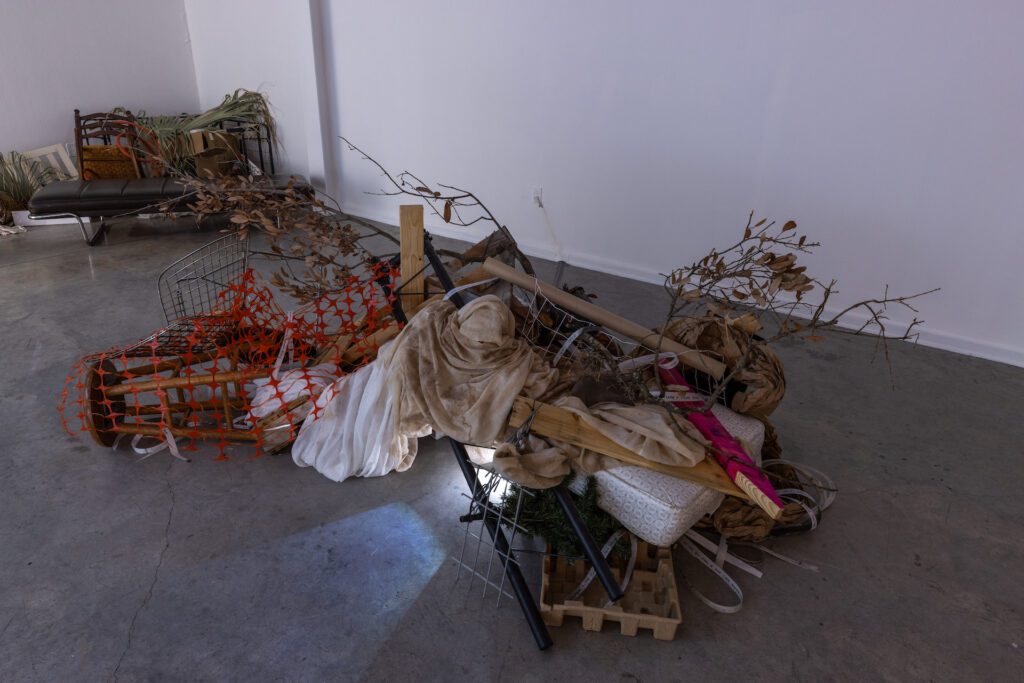 An immersive installation of found objects in Hammonds + West’s exhibition “The River Entered My Home” at Art League Houston. (Photo by Alex Barber)
