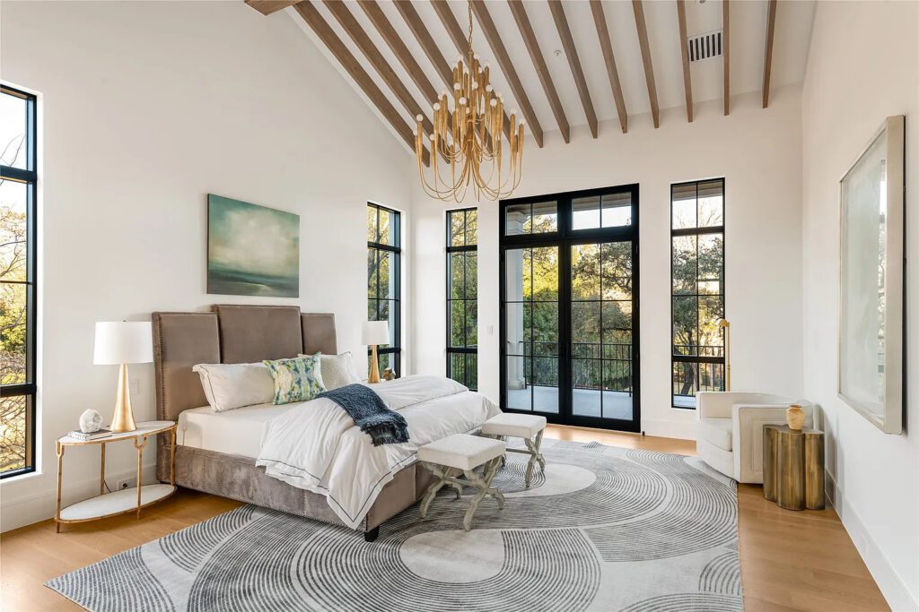 Vaulted ceilings flood the owner's wing with natural light, perfect for sitting a spell in front of the fireplace. (Photo by Allie Beth Allman & Associates)