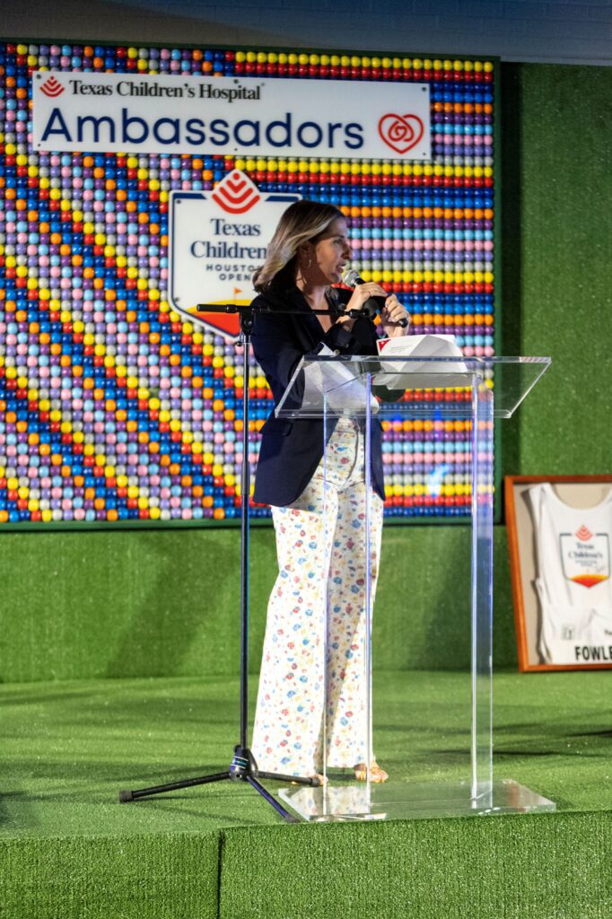 Auctioneer Brittany Franklin at the Texas Children's Ambassadors 'Glow in the Park' fundraiser (Photo by Jenny Antill)