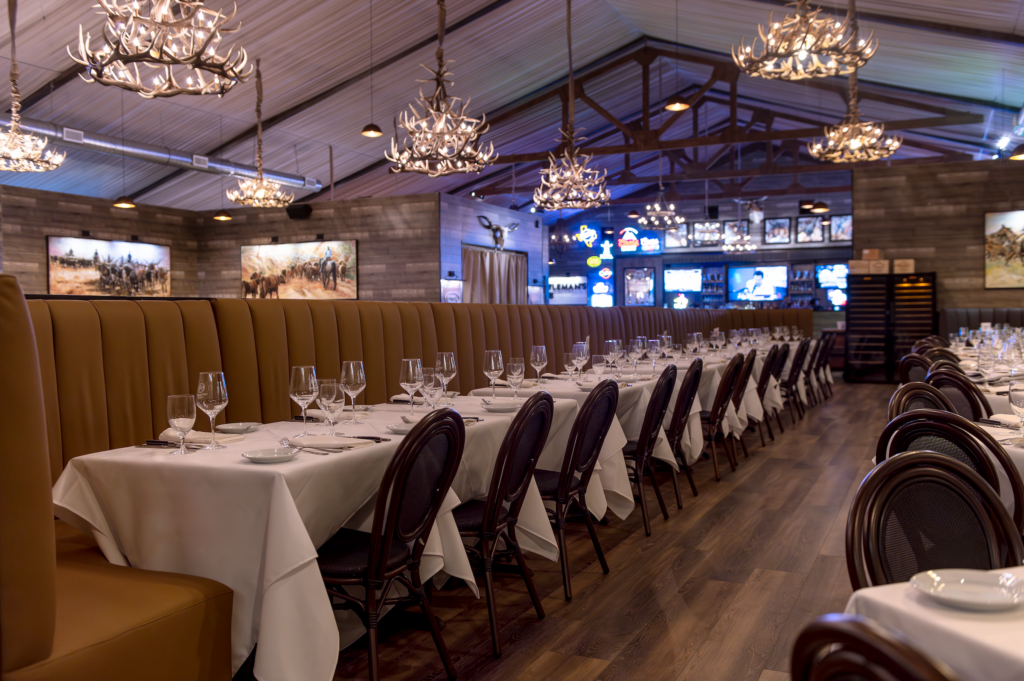 Banquet seating and stylish chairs along with white tablecloths create an upscale ambience (Photo courtesy of Fertitta Entertainment) (Photo by Photo courtesy of Fertitta Entertainment)