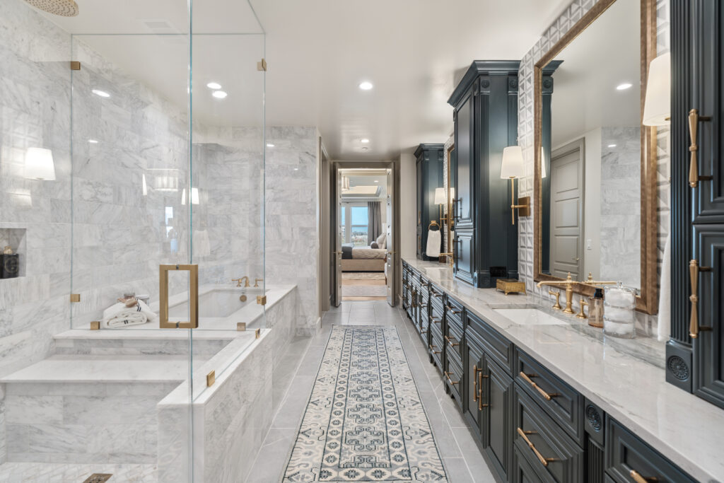 Bathrooms in The Langley feature a soaking tub and a rainhead shower with multi-function fixtures. (Photo by Josh Gremillion with Gremillion Media) 