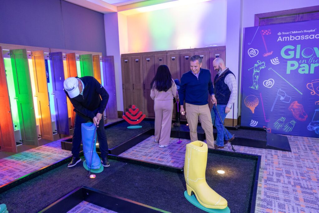 Glow-in-the-dark putting at the Texas Children's Ambassadors 'Glow in the Park' fundraiser (Photo by Jenny Antill)