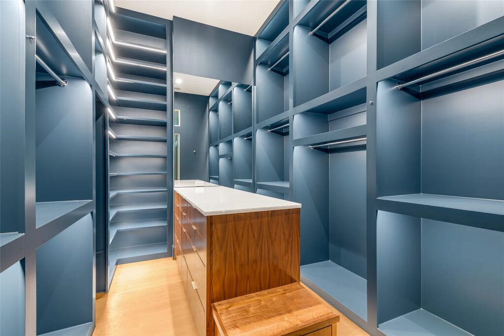 "His" closet provides a safe and luggage storage. (Photo by Allie Beth Allman & Associates)