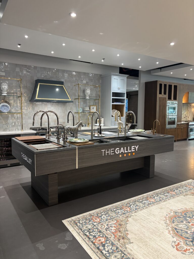 The Galley system at the nww Acero Bella showiroom in The Woodlands gives homeowners great flexibility when creating a kitchen system that works in many sink lengths, with accessories to boost efficiency.