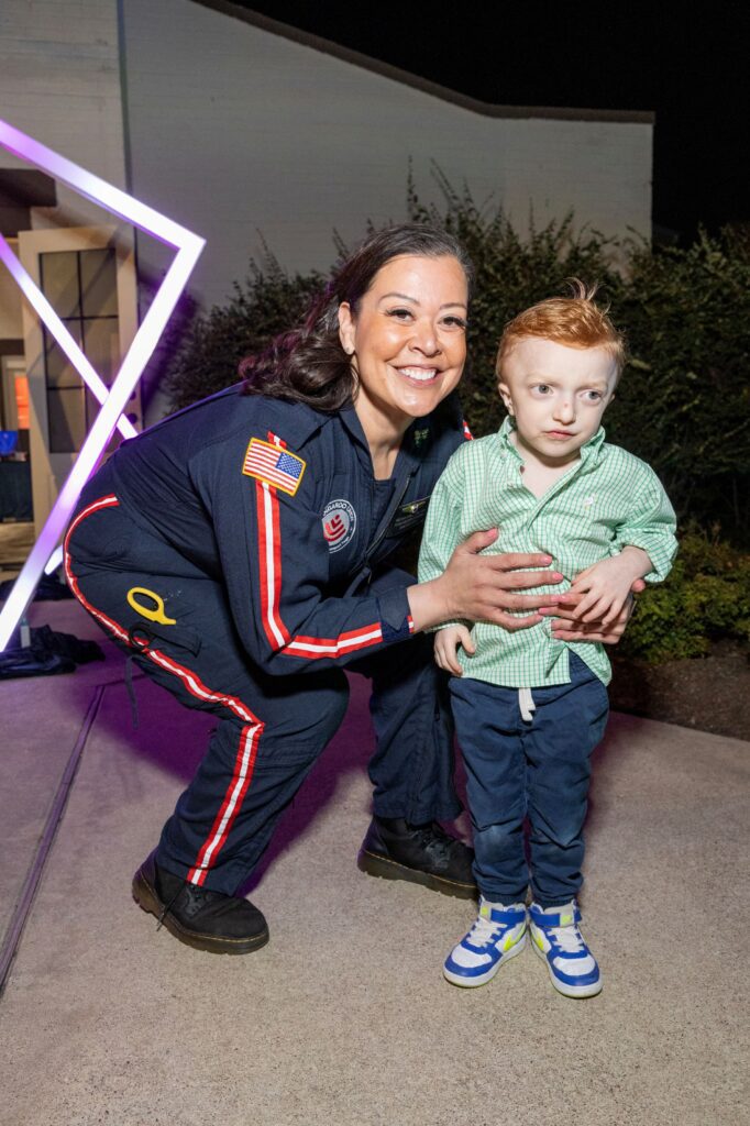 Melissa Campbell and patient Rierce Rowland at the Texas Children's Ambassadors 'Glow in the Park' fundraiser (Photo by Jenny Antill)