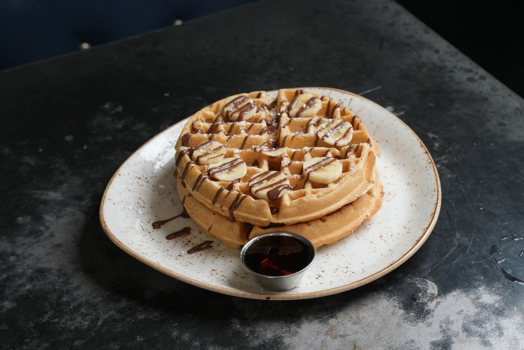 A Belgian waffle from State Fare Kitchen & Bar adds a sweet touch to its Easter brunch menu. (Photo by Ben Brown)
