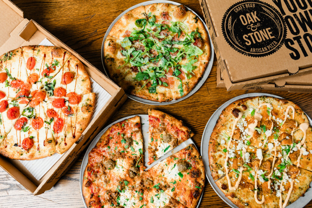 Oak & Stone's menu features pizzas, wings, and rotating seasonal offerings. (Courtesy)