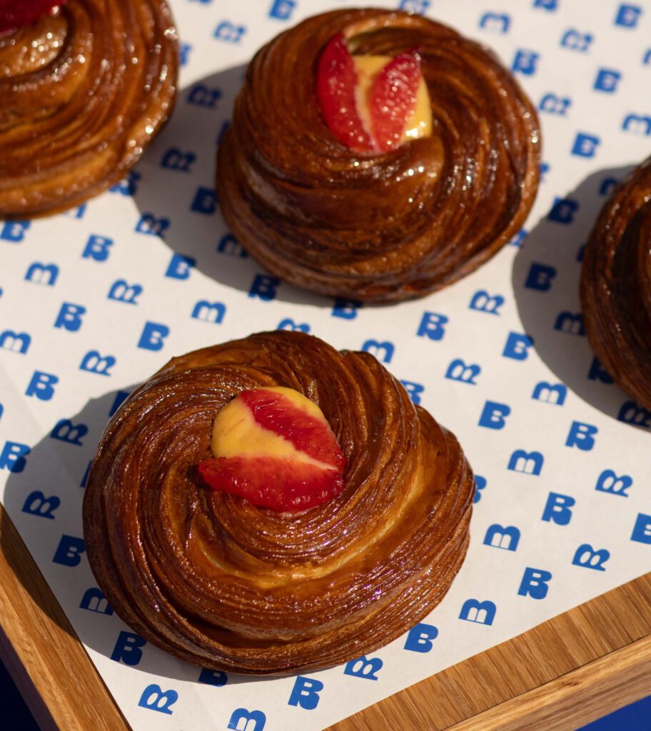 The menu includes a breakfast sandwich on a Mexican torta bun with chipotle aïoli, the Milanese loaf draws on Italian risotto flavors, the Piña Colada Matcha blends the Caribbean cocktail with Japanese matcha, and more, showing the global inspiration from The Bread Club. (Courtesy)