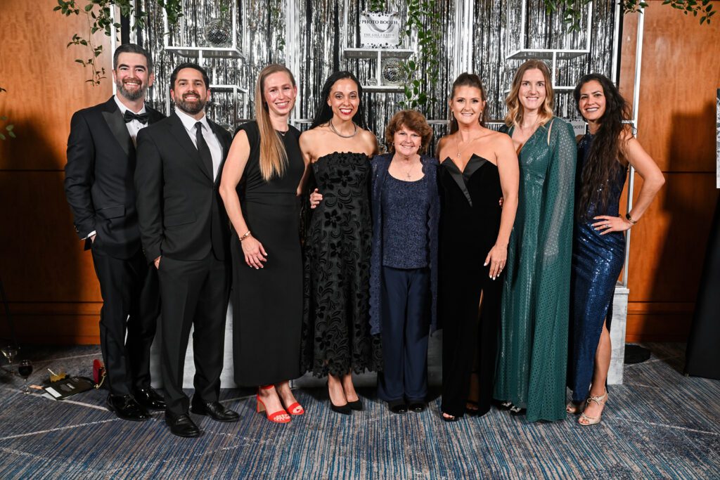 Gala co-chair Taryn Leto’s kindergarten teacher Colleen Banks (third from right) attended The John Cooper School’s 25th anniversary gala. (Photo by Armin Caratao Photography)