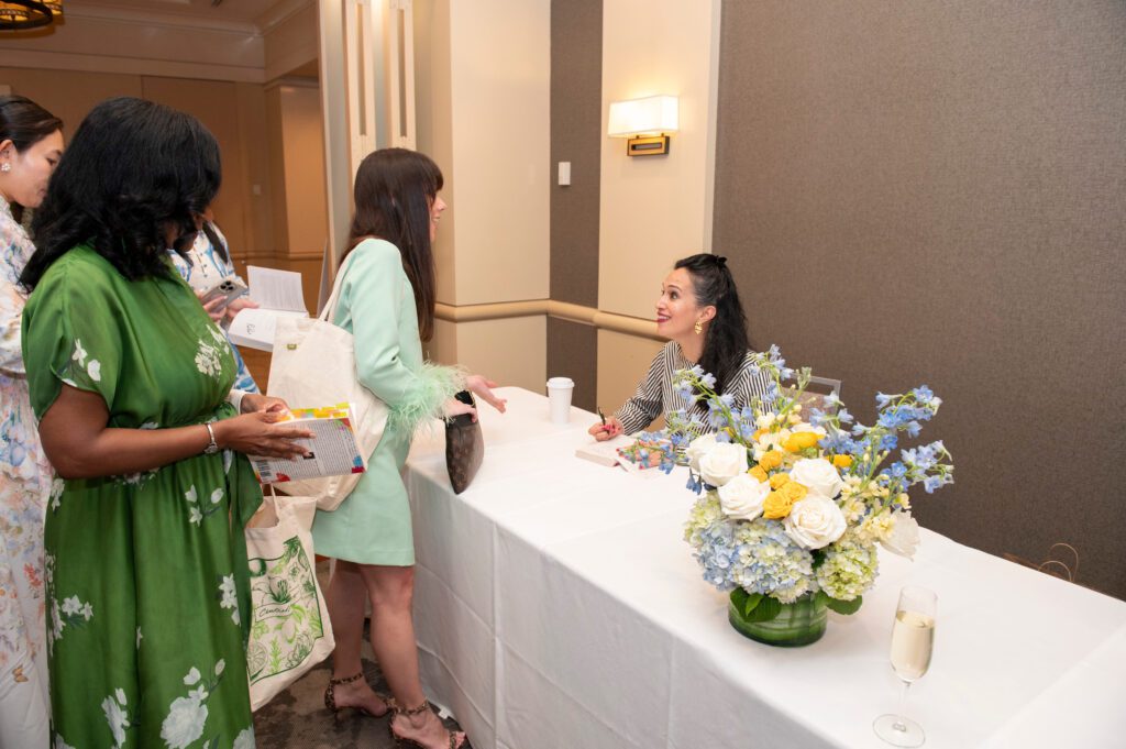 Featured Speaker Priya Parker signing books for JLD Diversity, Equity, Inclusion & Belonging Vice President Michelle Prudhomme-Coleman, JLD Membership Vice President Jessica Pantano (Photo by Tamytha Cameron and Celeste Cass)