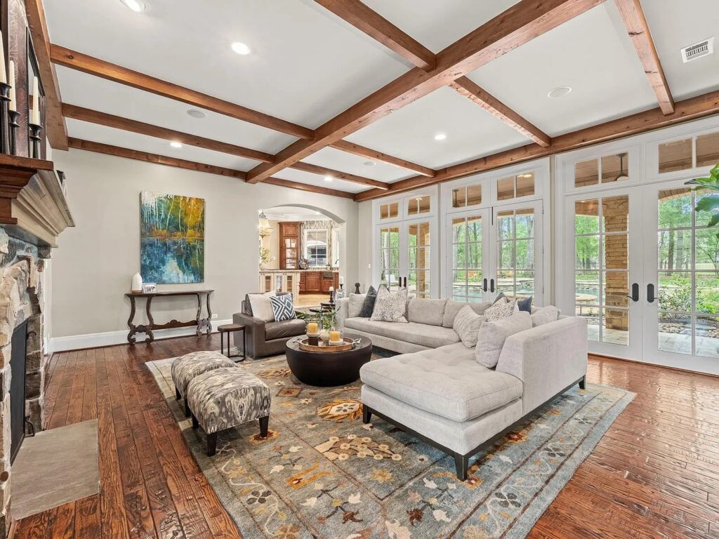 Natural wood beams and sunshine make the room feel bright and cozy.