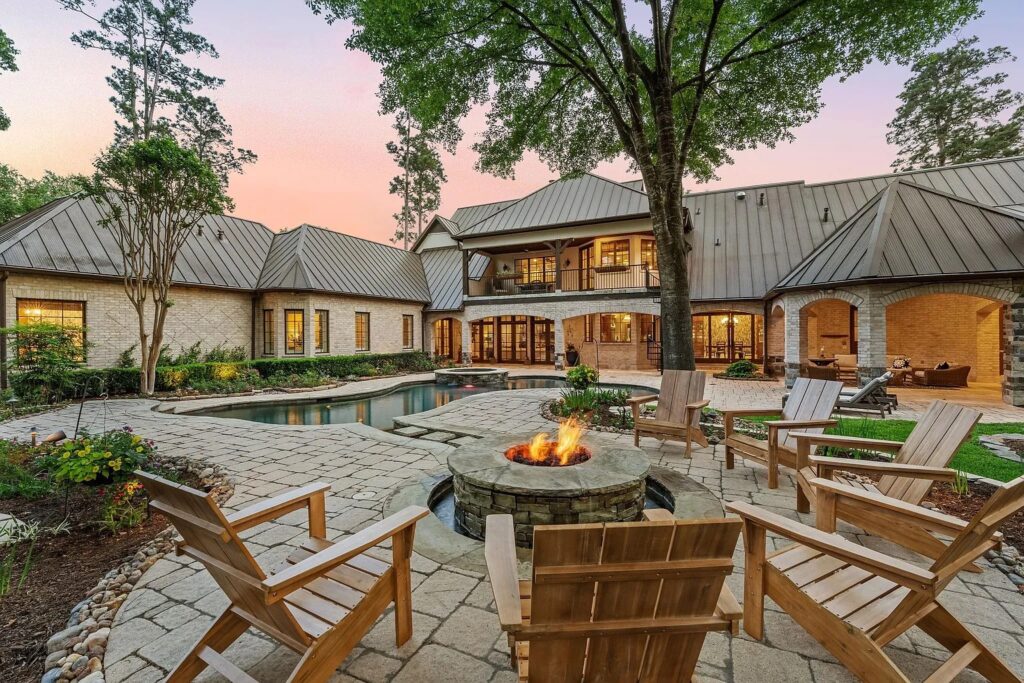 Expansive windows frame the backyard oasis and bring in natural light.