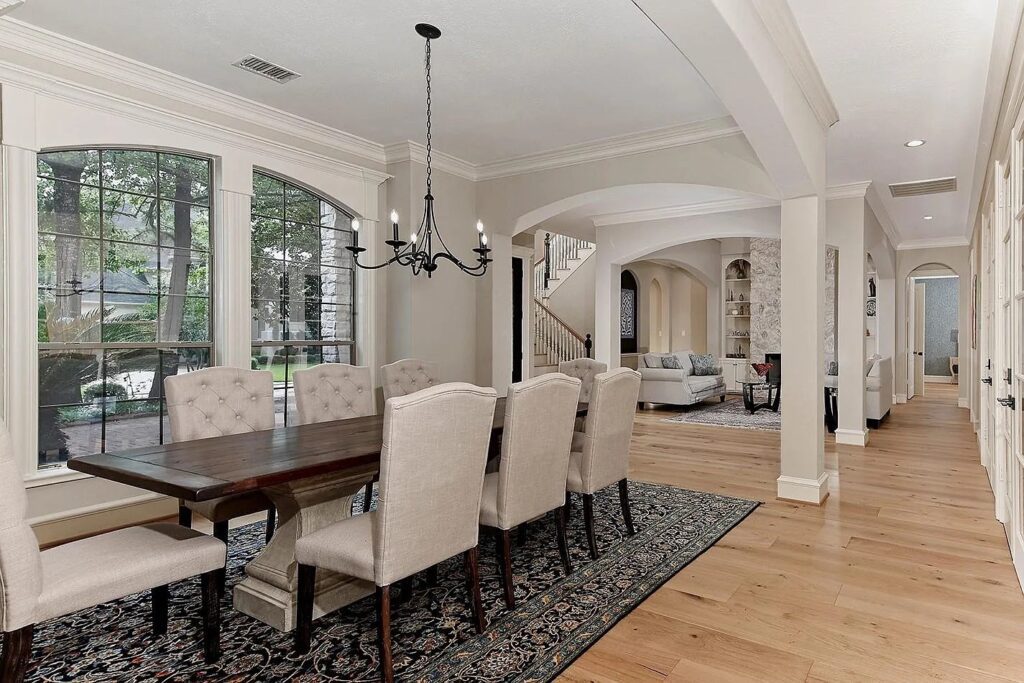 Formal dining rooms feel even more refined with windows like these.