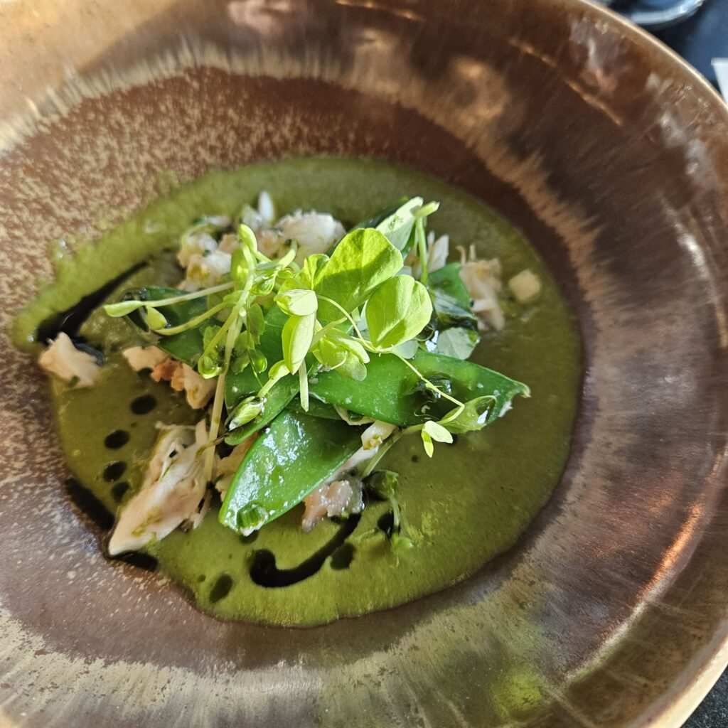 Marcus Kopplin: "Crab and apple go really well together, so for the soup, we threw in peas, mint, and a bit of green garlic into the broth." (Courtesy)