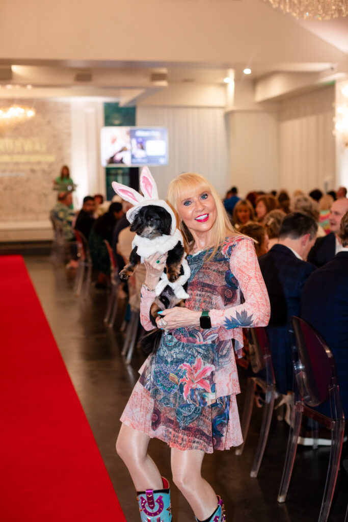 Allison Ye snuggles her pup in a bunny suit on the runway during Operation Pets Alive’s Rescues on the Runway event at The Peach Orchard. (Photo by CS Wedding Co.)