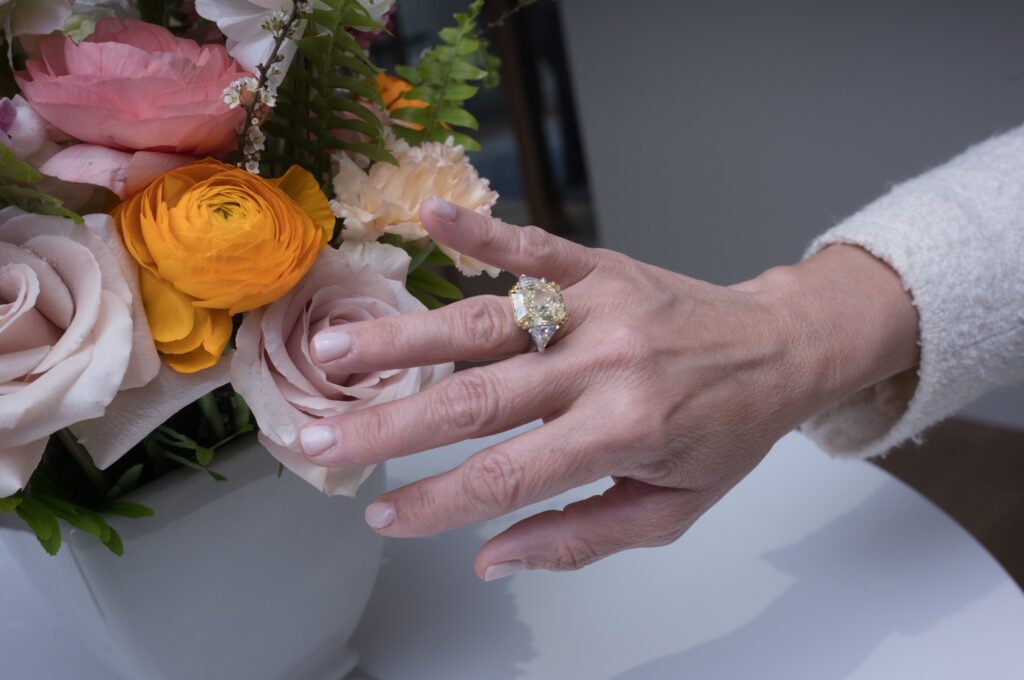 A fancy intense yellow/VS1 clarity diamond ring, 14.71 carats headed to the Phillips auction in June  (Photo by Daniel Ortiz)