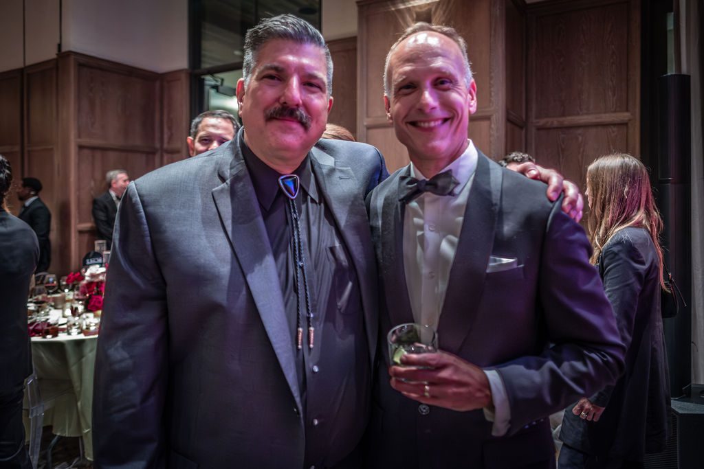 Visit Fort Worth VP of Creative, Film, and Music Tom Martens (left) poses with Chad Mathews at a recent gala. (Photo by Olaf Growald)