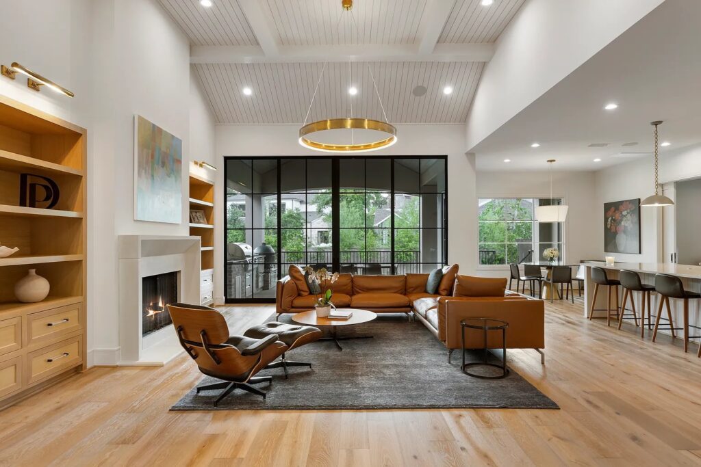 Wall-length windows and an open floor plan allow for abundant natural light.