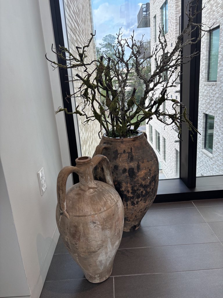 Antique vases throughout 1 Riva Row  are from Living Century.  Each are tagged with the country of origin. (Photo by Laura Landsbaum)