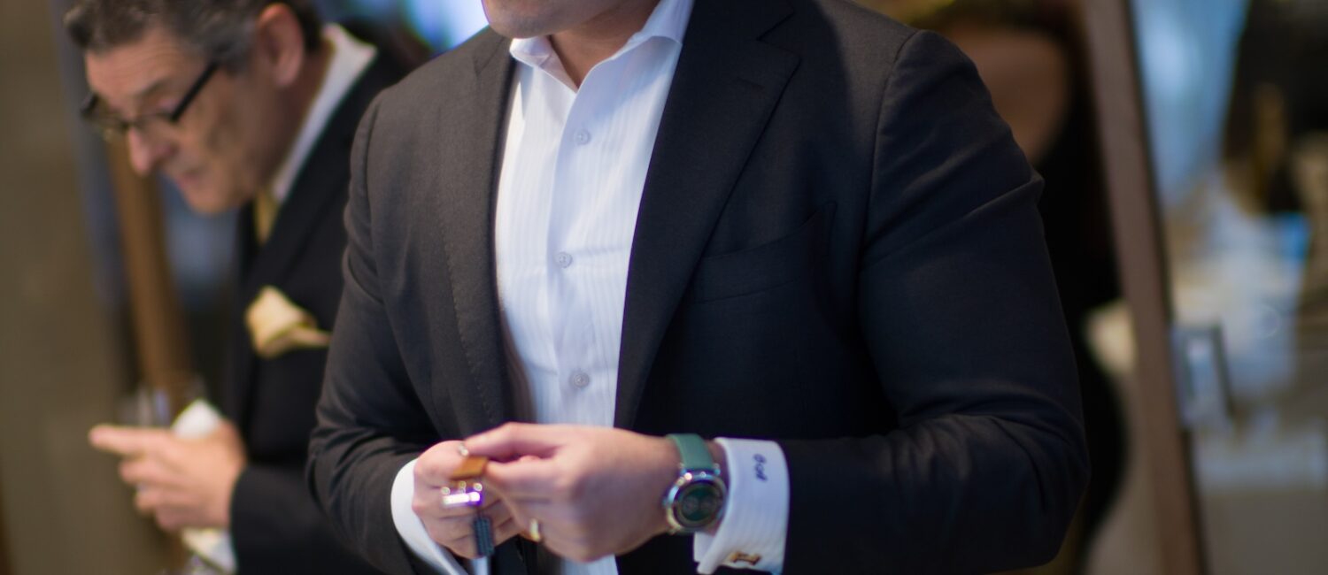 A guest is intrigued by watches on view at the St. Regis Residences Houston/Phillips cocktail party (Photo by Daniel Ortiz)