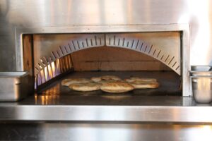 Baking Pita (Photo by Photos courtesy of Brassica)