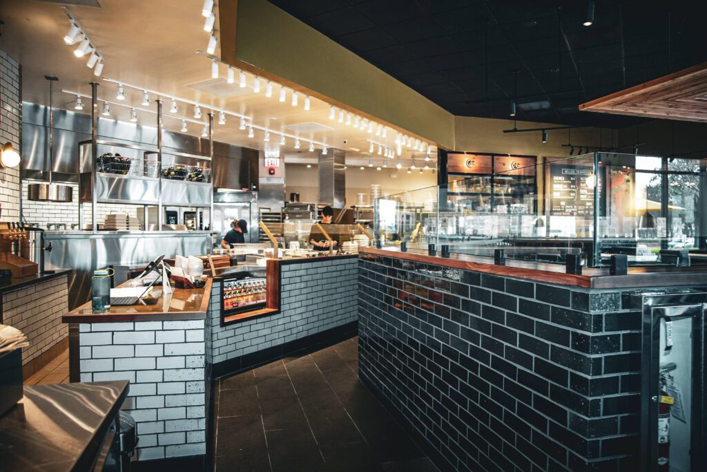 You’ll find a dining room appointed with marble tables and rich leather banquettes at Brassica. (Photo by Photos courtesy of Brassica)