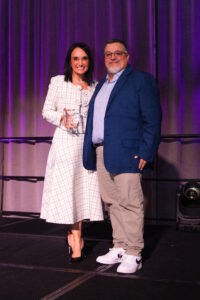 CPD president and CEO Joanna Clarke presenting Paige McDaniel Partners for Children Award to AWS representative Alberto Bayarena (Photo by Tamytha Cameron, Celeste Cass, Nate Rehlander and Kelly Alexander)
