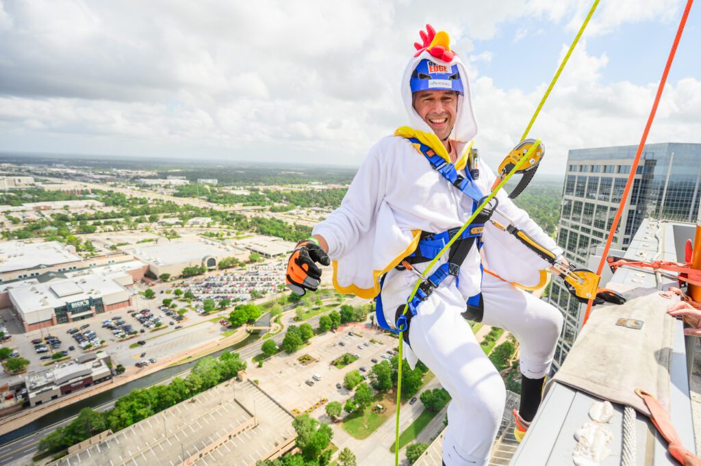 Camp For All COO Brian Frazier goes over the edge April 11 at The Woodlands Towers. (Photo by Si Vo Photography)