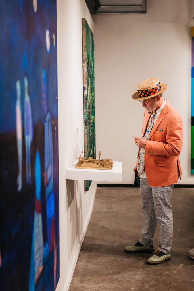 Guests at the VIP Preview Party got a first look at all the works for sale. (Photo by Chase Hall)