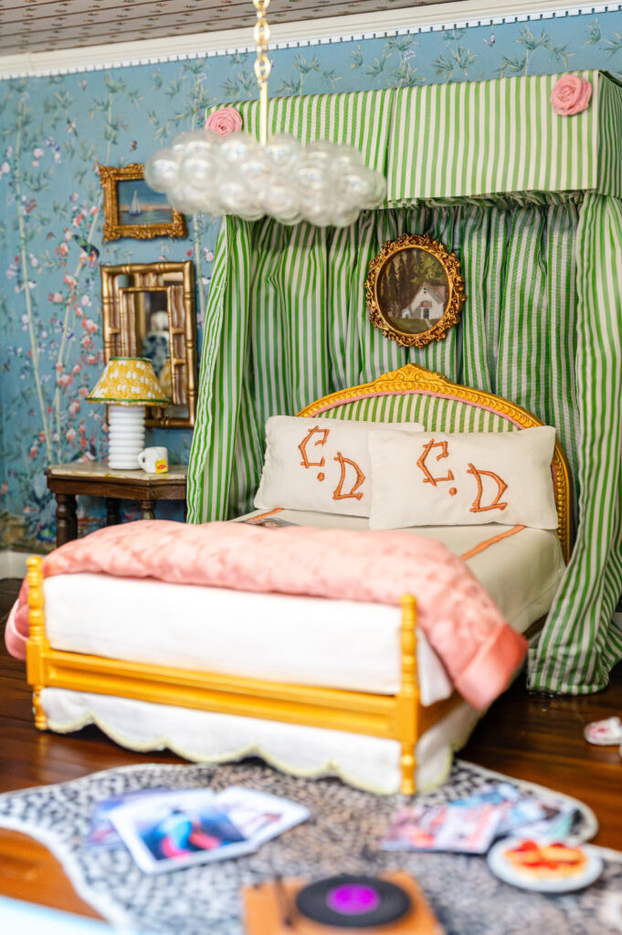 In "A Chinoiserie Aerie" by Coco & Dash Interiors, the charming miniature bedroom feels like a little world of its own. (Photo by Caroline Guinn Photography)