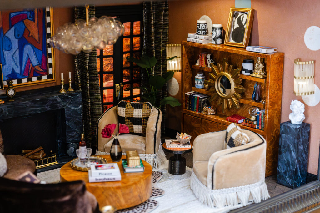 "The Pulp Parlour" by Pulp Design Studios features rich burl wood, sculptural seating, and moody lighting that set the tone for a space designed for lingering. (Photo by Caroline Guinn Photography)