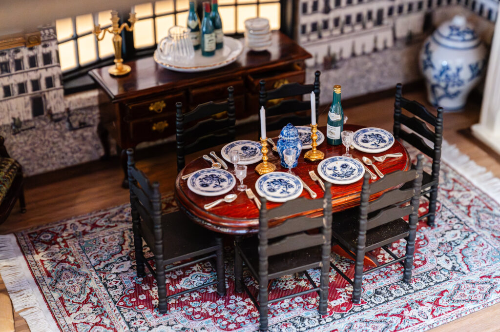 "The Florentine Midnight Table" by 
Burkle Creative features Schumacher’s "Piazza Firenze" panel wallpaper. (Photo by Caroline Guinn Photography)