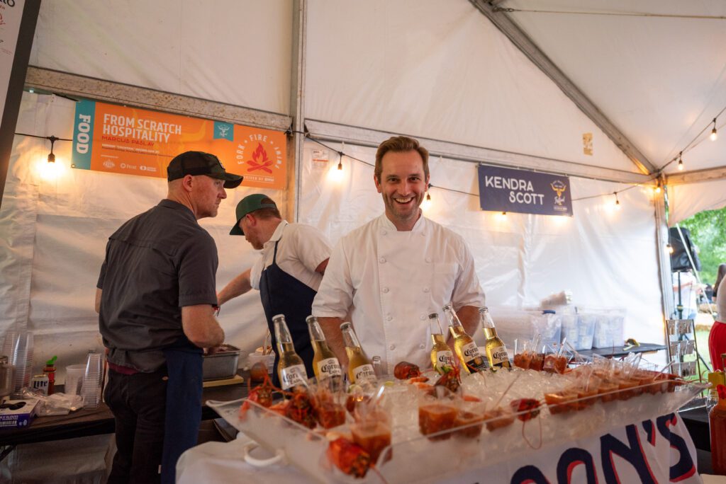 Chef Marcus Pasley served guests at the recent food and wine festival. (Photo by Nancy Farrar)