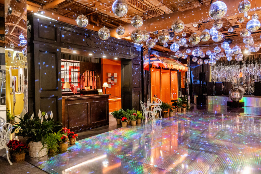 As guests meandered the streets of Paris, they popped into elaborately custom-constructed mini storefronts to "shop." (Photo by Anastasiia Photography)