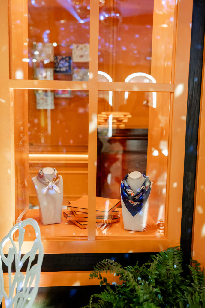 Female guests in attendance selected from a curated assortment of Hermes scarves to take home. (Photo by Anastasiia Photography)