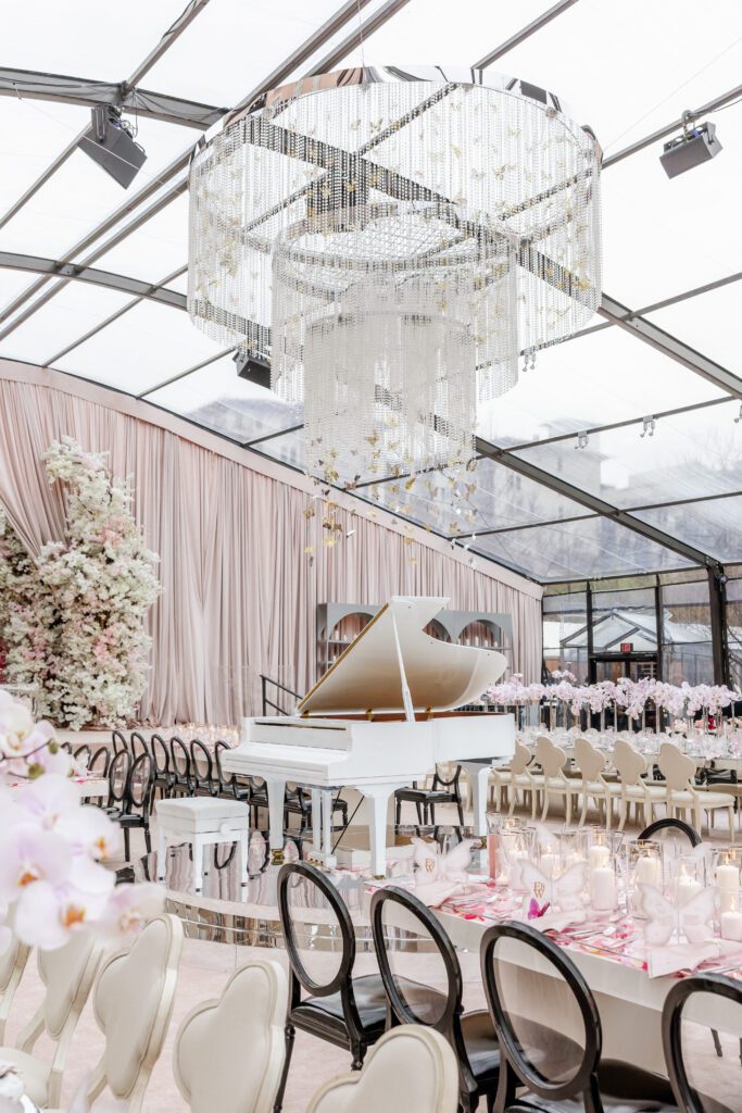 The tent on The Mansion's lawn was filled with florals, butterflies, and the color pink. (Photo by Anastasiia Photography)