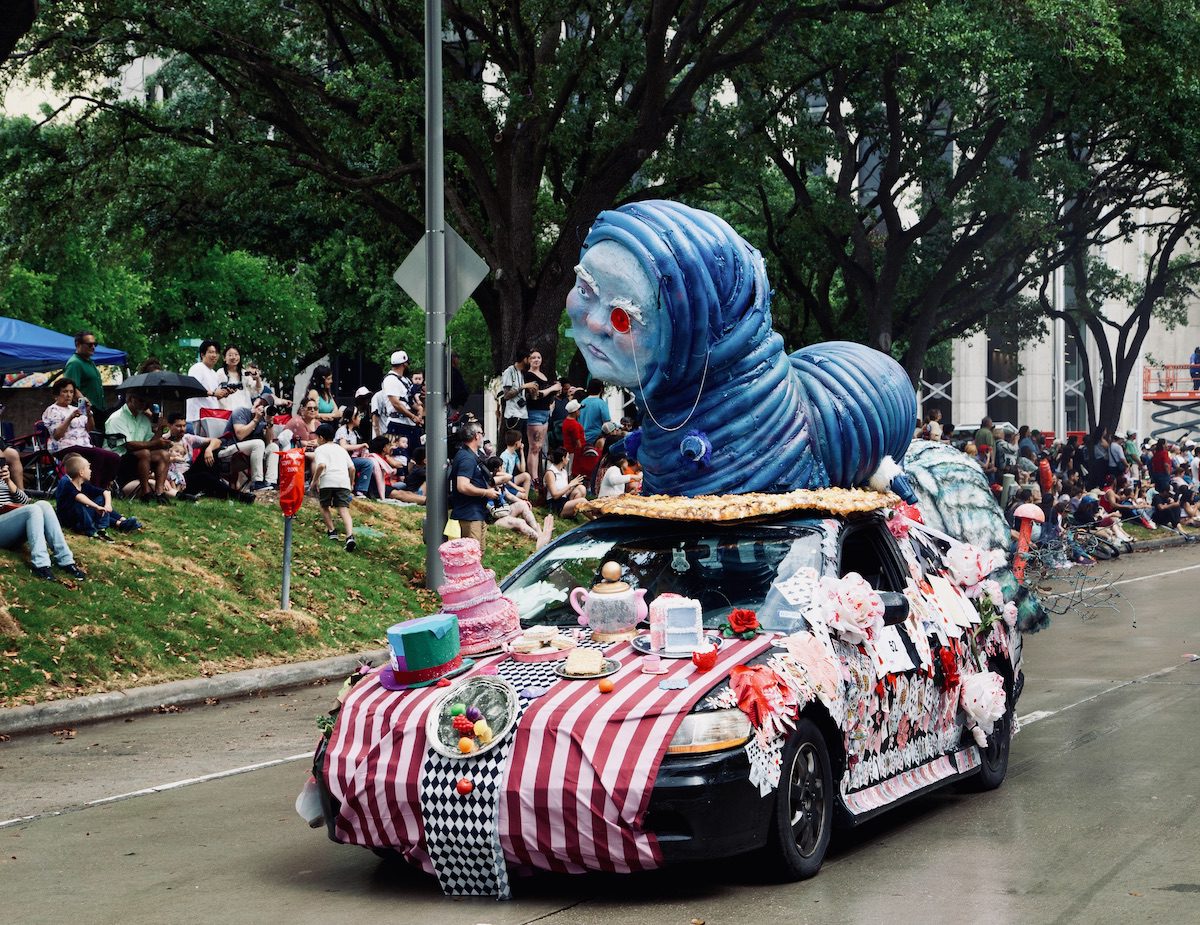 “Wonderland on Wheels” by the Spring Woods Chroma Crew of Spring Woods High School at the Orange Show’s 39th Annual Art Car Parade. (Photo by Mike Herrera)