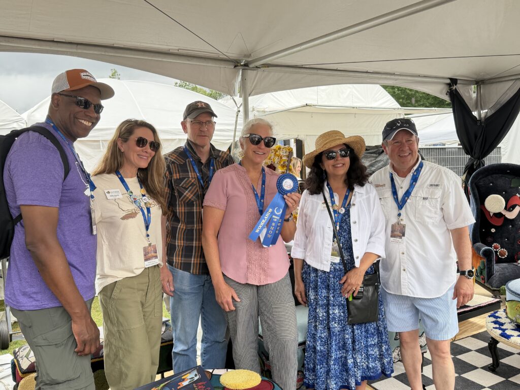 Ted Harris, Haley Garcia, Mary Beth McGinnis and her husband, Jenny Carattini-Wright and Nick Wolda. McGinnis, a Houston-based fiber artist, won Best of Show in Fiber at the 2026 Woodlands Waterway Arts Festival. (Photo by Laura Landsbaum)