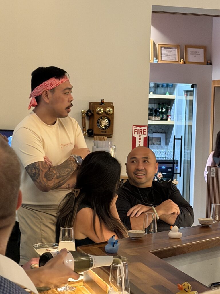 Kokoro team member Justin Dionisio chats with diners between courses at Kokoro Handroll Bar’s Woodlands Waterway location during the collaboration dinner. (Photo by Laura Landsbaum)