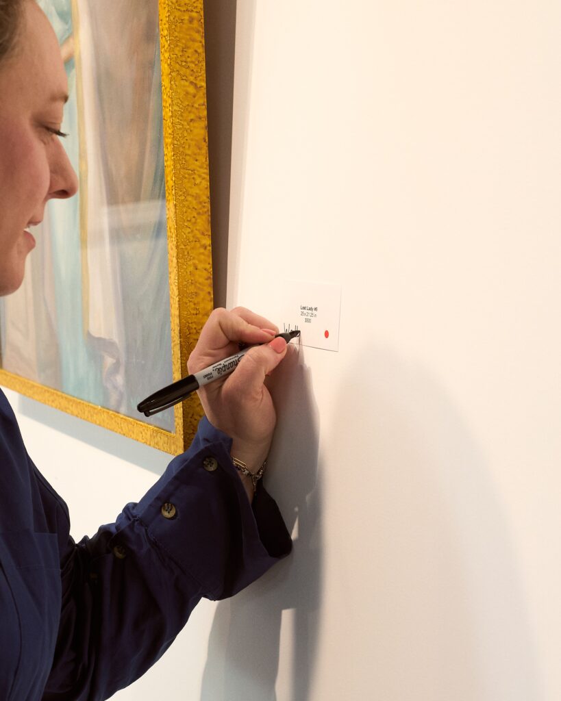 After purchasing, the buyer was given a Sharpie and asked to give their Lady a name and begin rewriting the story of who she was. (Photo by Heather Halbert)