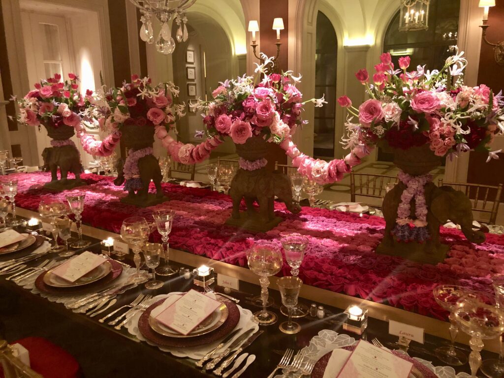 Elephants parading on a bed of roses covers the tabletop at this private dinner celebrating the hosts' recent trip to India. (Photo by Shelby Hodge)