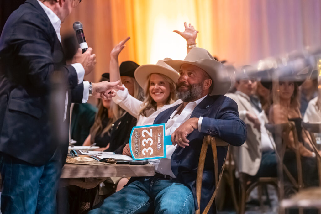 Spirited bidding led by auctioneer Will Murphy raised more than $1.2 million for The Woodlands Christian Academy endowment. (Photo courtesy The Woodlands Christian Academy)