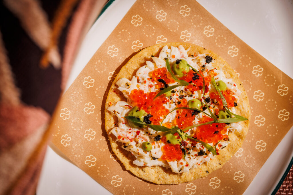 Bites like the Peekytoe Crab Tostada are must-tries on the Maroma menu. (Photo by Samantha Marie Photography)