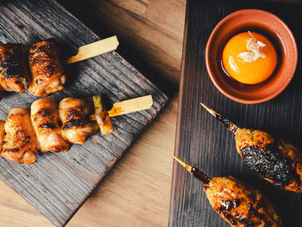 The yakitori program at Toga is centered on a trio of organically sourced chicken cuts threaded on wooden skewers.