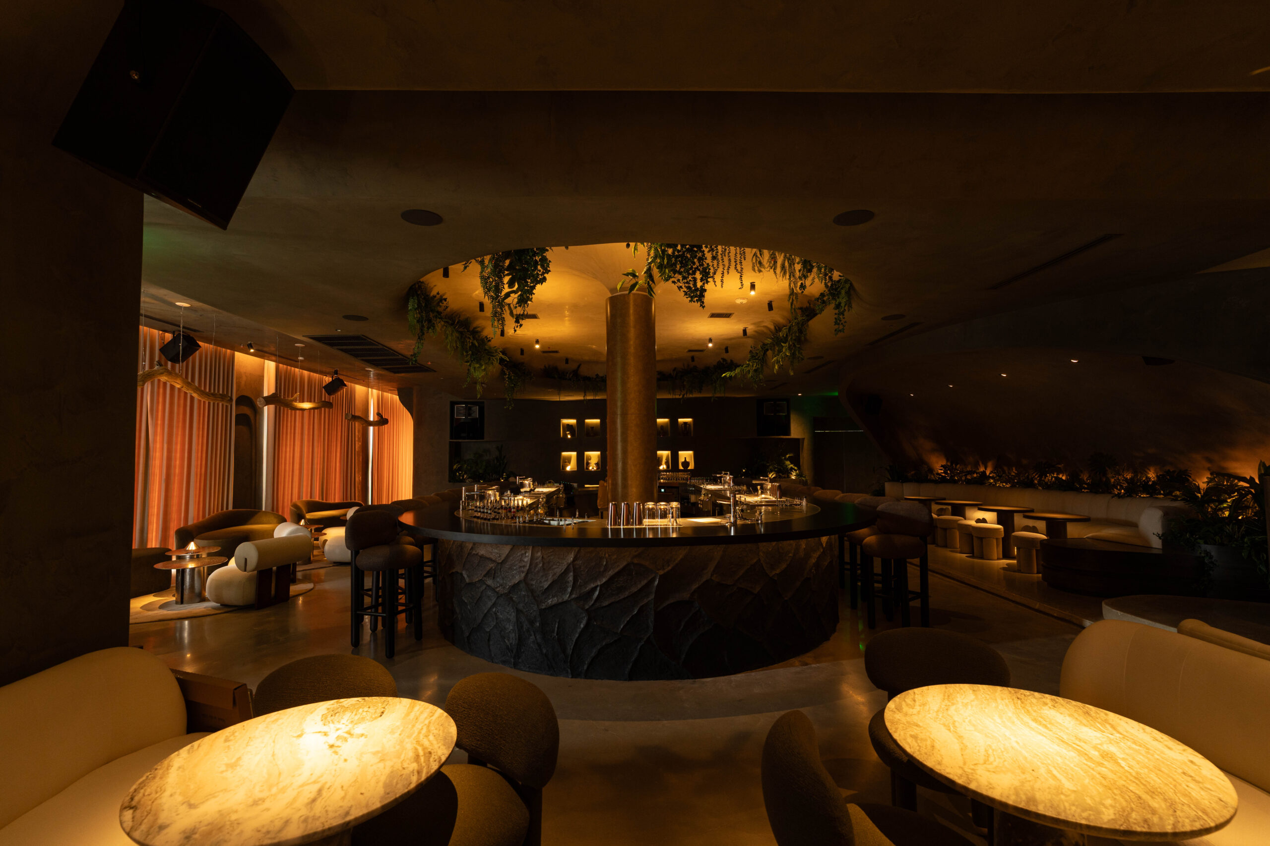 Anchoring the 4,500-square-foot 1111 Bar is the custom oval bar outfitted with five completely self-contained stations. (Photo by Jason Haas)