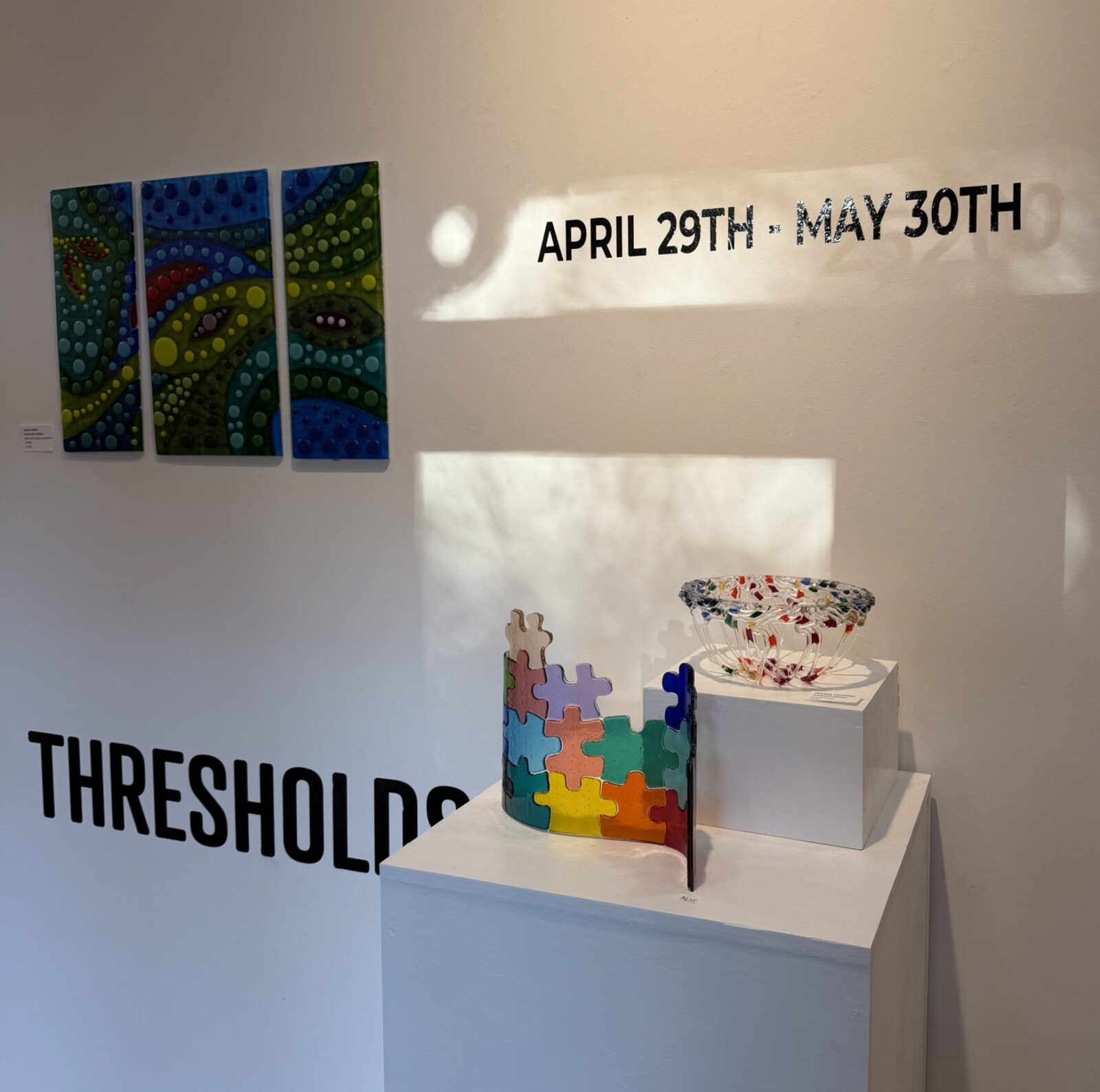 "Thresholds" features glass works in a variety of ways and runs through May 30. Mary Torres' "Polka Dot Jungle," far left, took second place honors. (Photo by Laura Landsbaum)