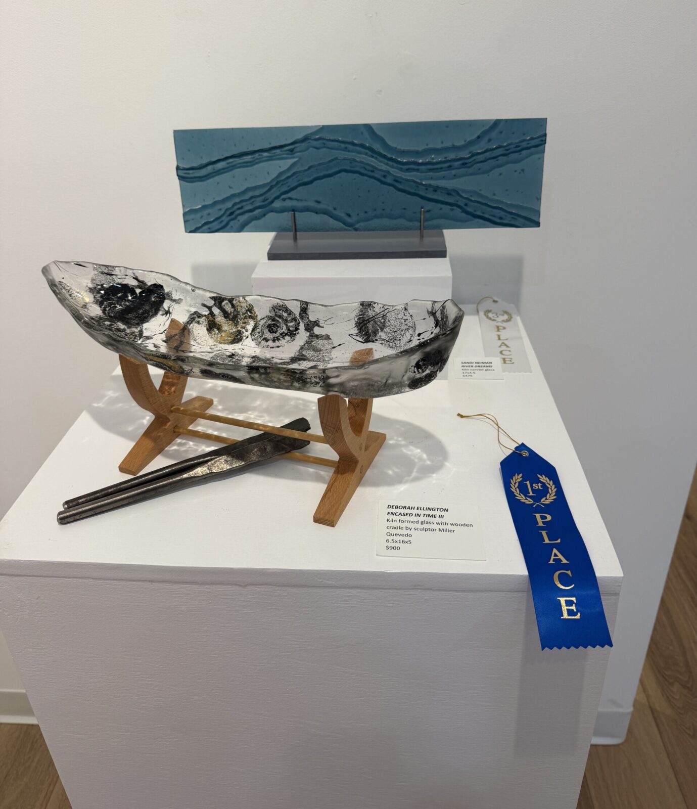 The first-place piece by Deborah Ellington features a wooden cradle created by Houston sculptor Miller Quevedo. (Photo by Laura Landsbaum)
