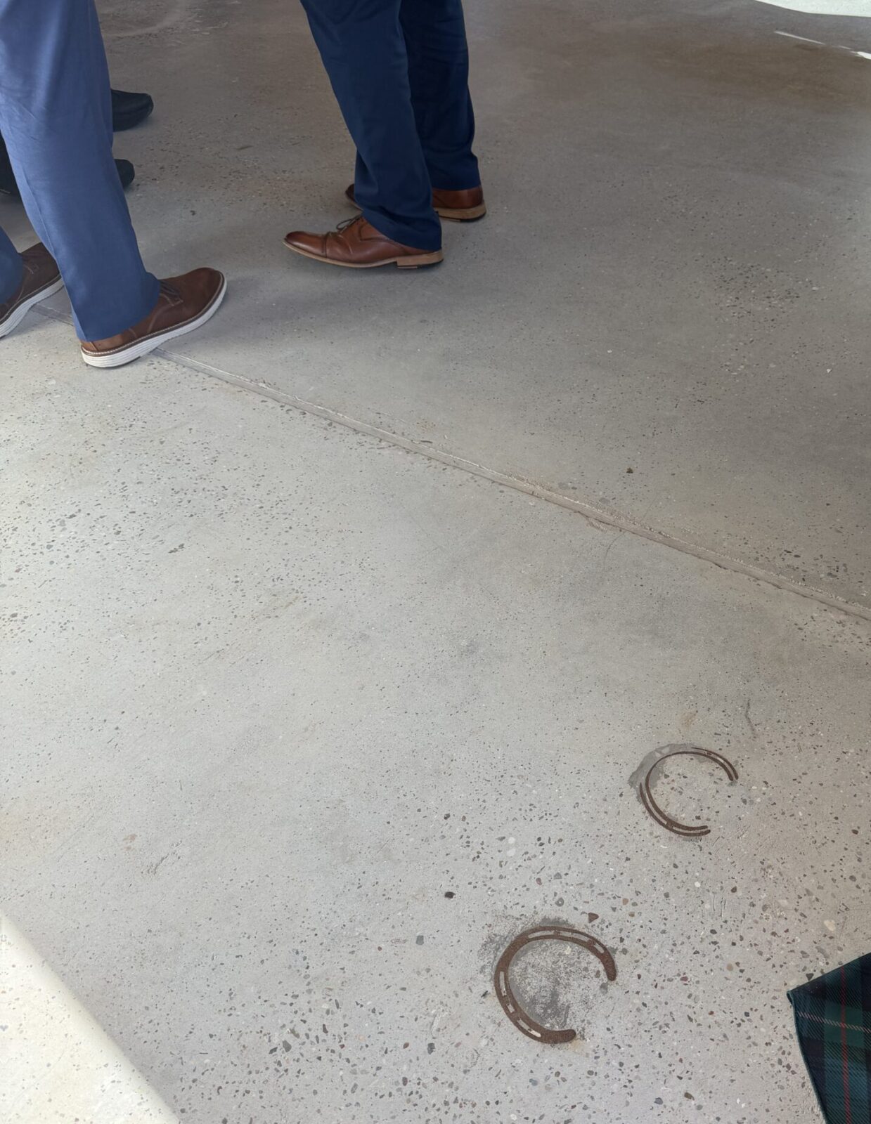 During renovations to the horse stables, these horseshoes remained in the floor as a nod to the past. (Photo by Laura Landsbaum)